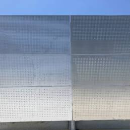 Equipment screen in perforated aluminum plate panels.